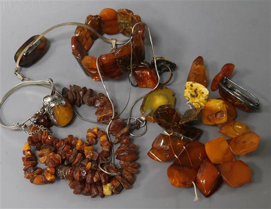 A small group of amber items, including bracelets, necklace, pendants and brooches.